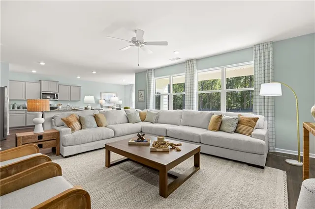 a living room with furniture and a large window