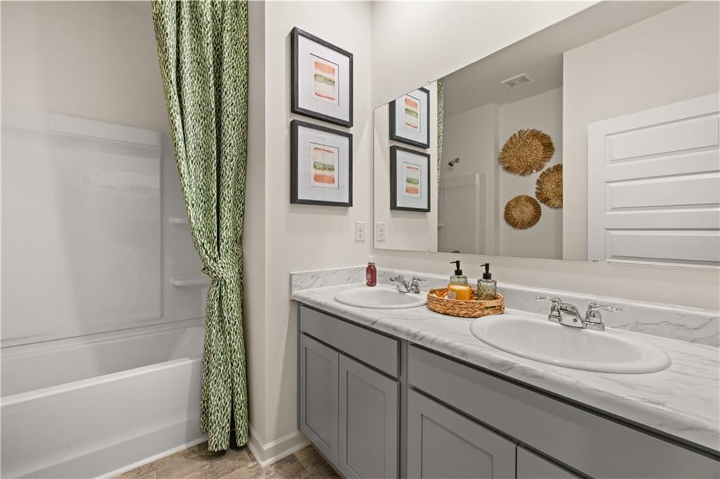 1080 Amerson Street Buckhead, GA 30625 - Photo 46 of 51 a bathroom with a sink and a mirror