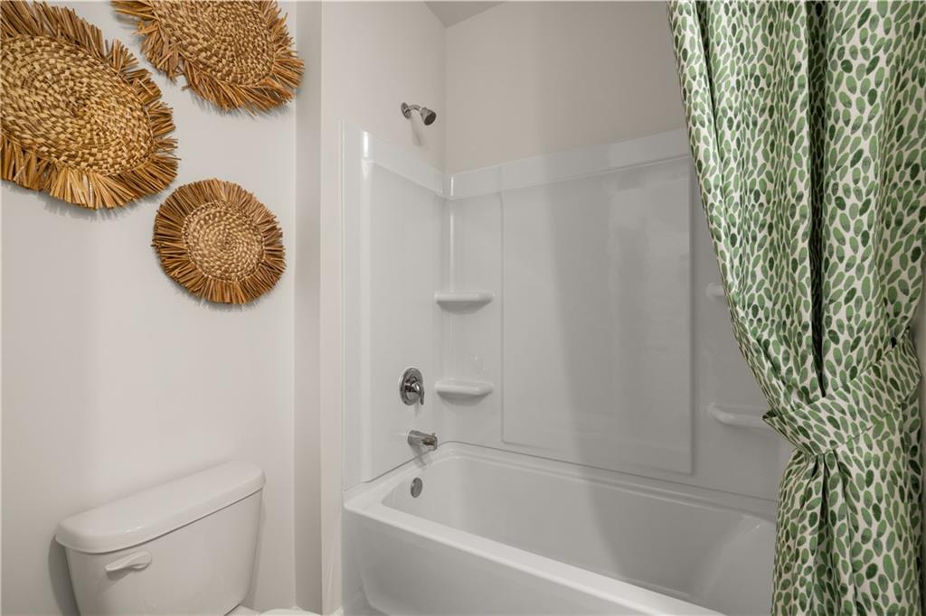 1080 Amerson Street Buckhead, GA 30625 - Photo 47 of 51 a bathroom with a toilet and a bathtub
