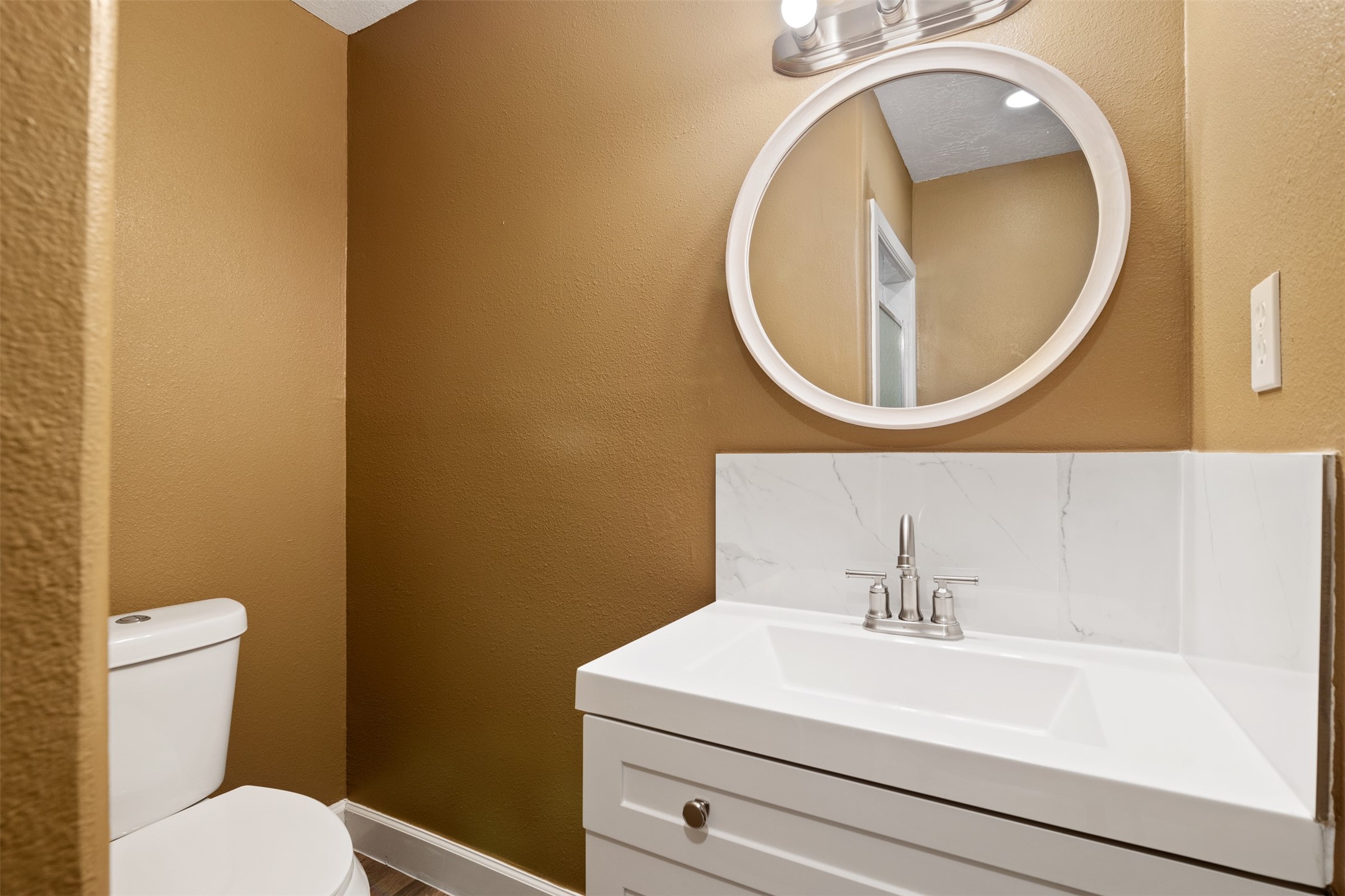 38210 Green Willow Street, Unit A Magnolia, TX 77355 - Photo 13 of 16 a bathroom with a sink and a mirror