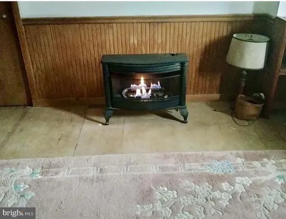 a room with a fireplace and a window