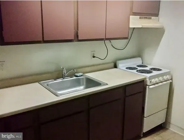 a bathroom with a sink and cabinets