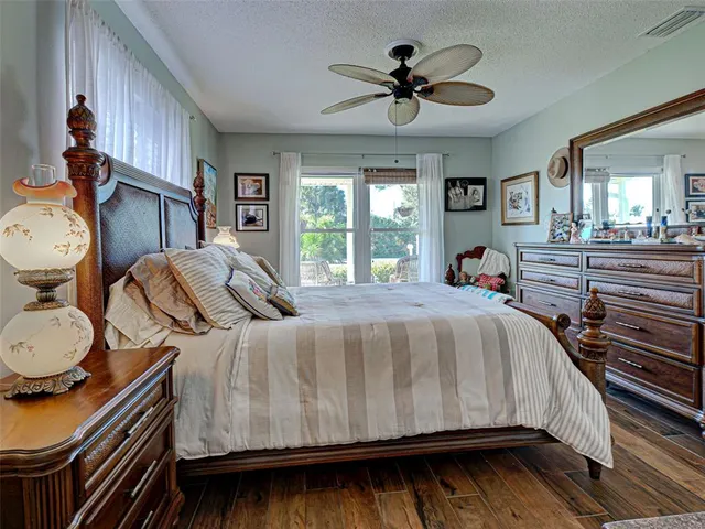 a view of a house with swimming pool and sitting area