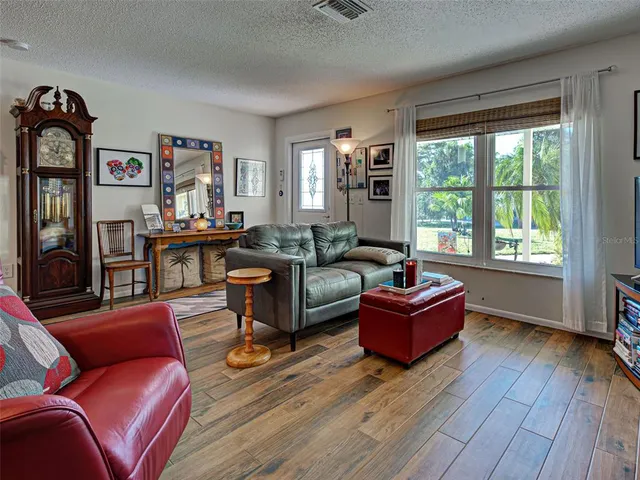 a kitchen with stainless steel appliances granite countertop a refrigerator sink and cabinets