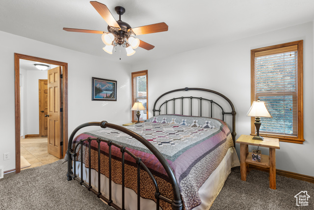 1340 Trapper Loop Garden City, UT 84028 - Photo 16 of 35 Bedroom featuring carpet flooring and baseboards