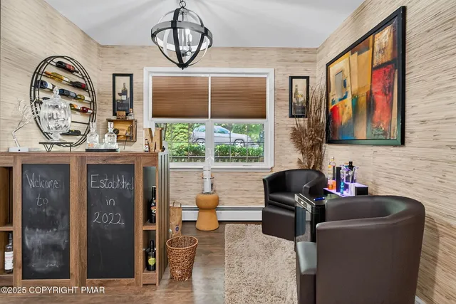 a living room with furniture a window and potted plants