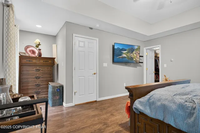 a bedroom with a bed and furniture