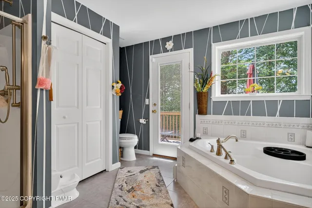 a bathroom with a sink a toilet and a tub