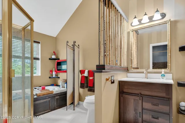 a bathroom with a sink vanity and mirror
