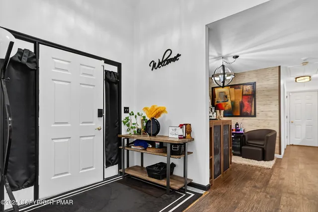 a view of a livingroom with furniture and toys