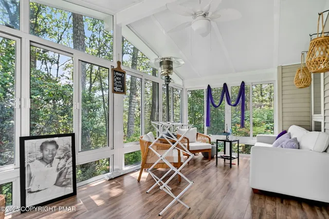 a living room with furniture and a large window