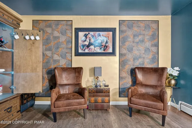 a living room with furniture and a chair