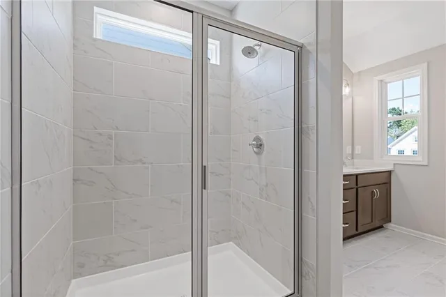 a bathroom with a bathtub and a shower