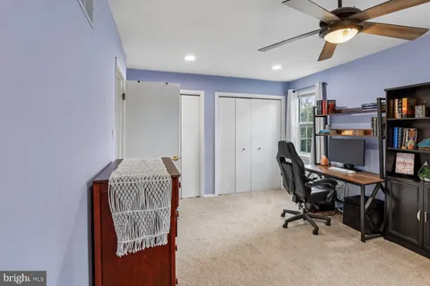 a view of a workspace with furniture