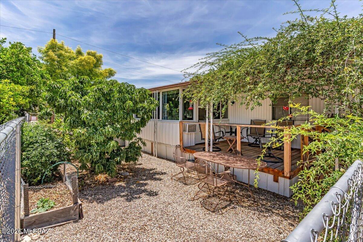 5379 West Rafter Cir Street Tucson, AZ 85713 - Photo 17 of 38 a view of a patio with table and chairs and potted plants