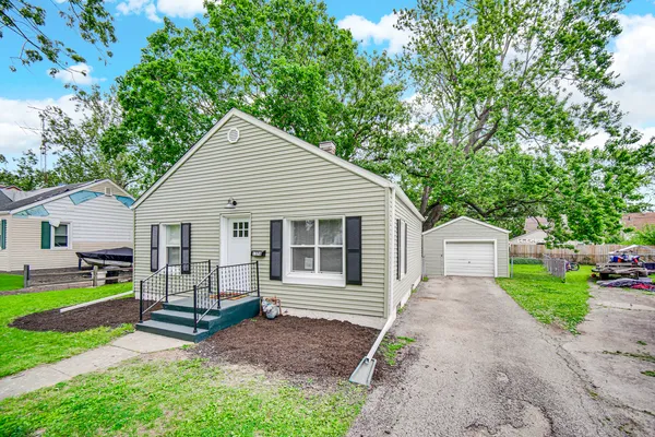 a view of a small house in the back yard
