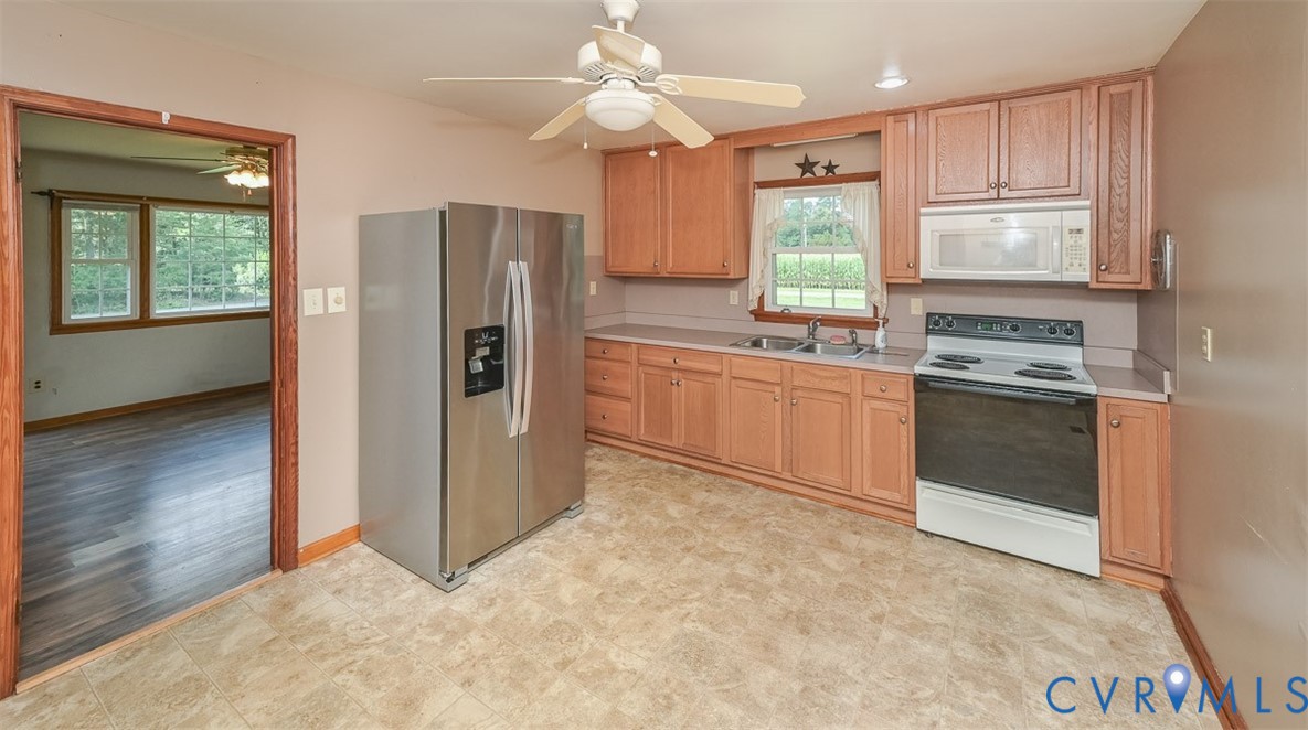 581 Smokey Road Aylett, VA 23009 - Photo 11 of 28 Kitchen featuring wood-finish cabinetry and a stai