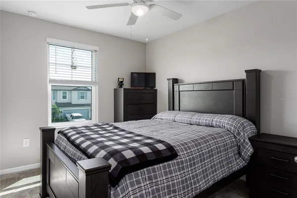 a bedroom with a bed and a dresser