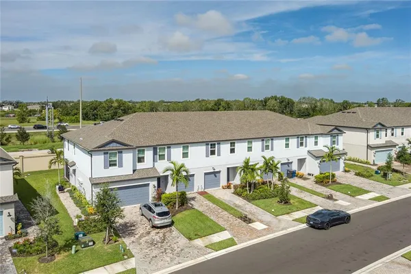 an aerial view of residential houses and street