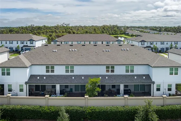 an aerial view of a building with a garden