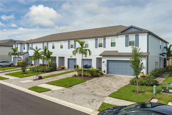 a front view of house with yard and green space