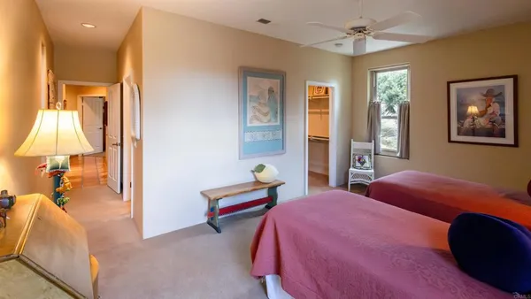 a bedroom with a bed and a lamp