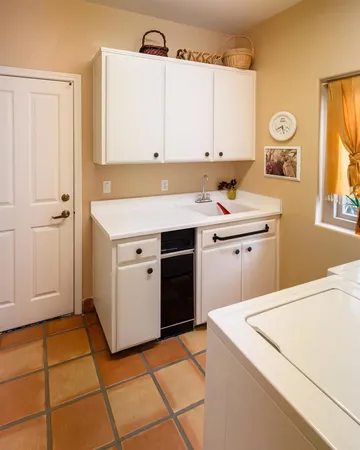 a utility room with washer and dryer