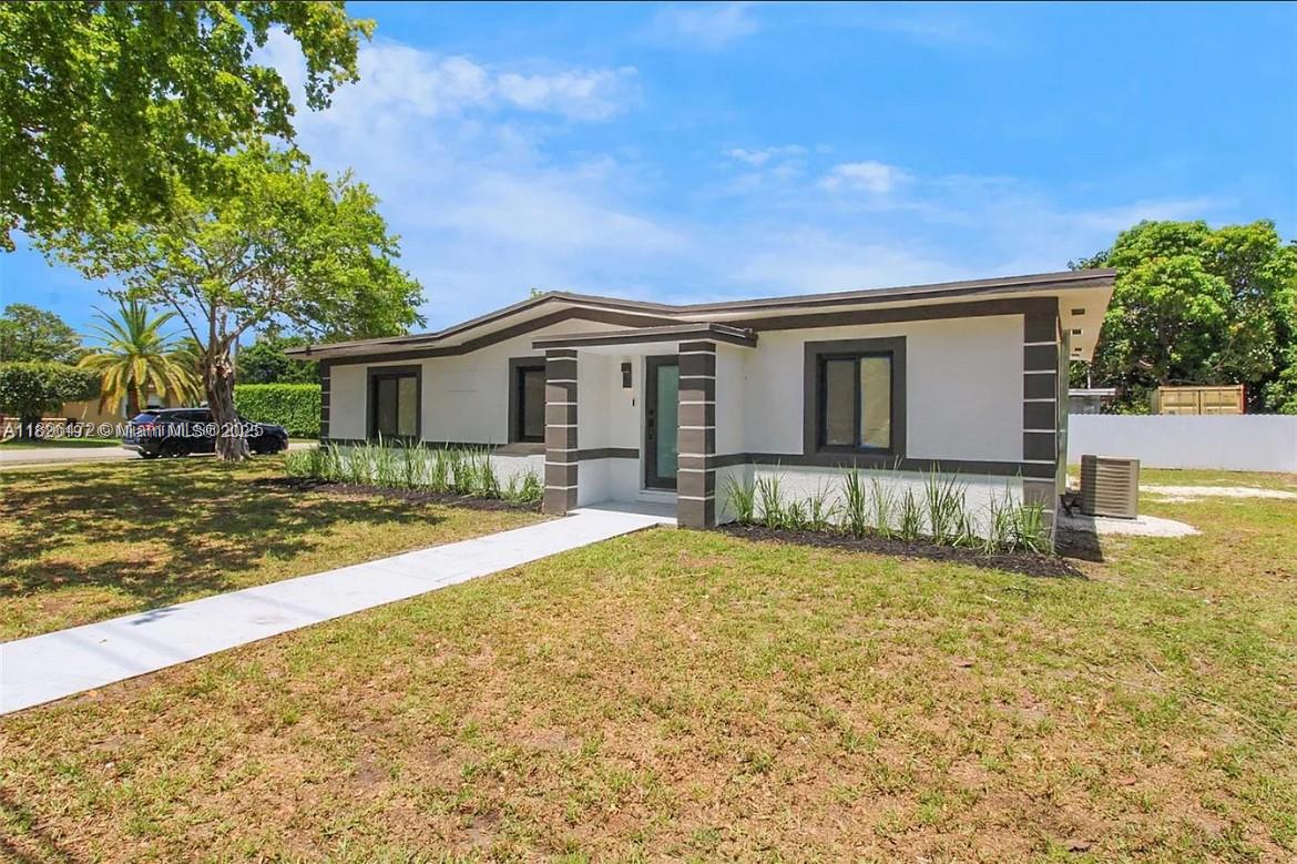 13885 Northwest 5th Avenue North Miami, FL 33168 - Photo 14 of 14 a front view of a house with a yard