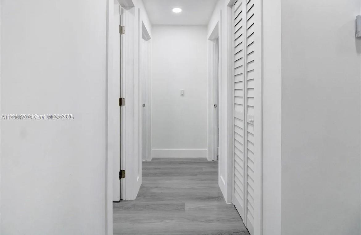 13885 Northwest 5th Avenue North Miami, FL 33168 - Photo 6 of 14 a view of a hallway with wooden floor and staircase