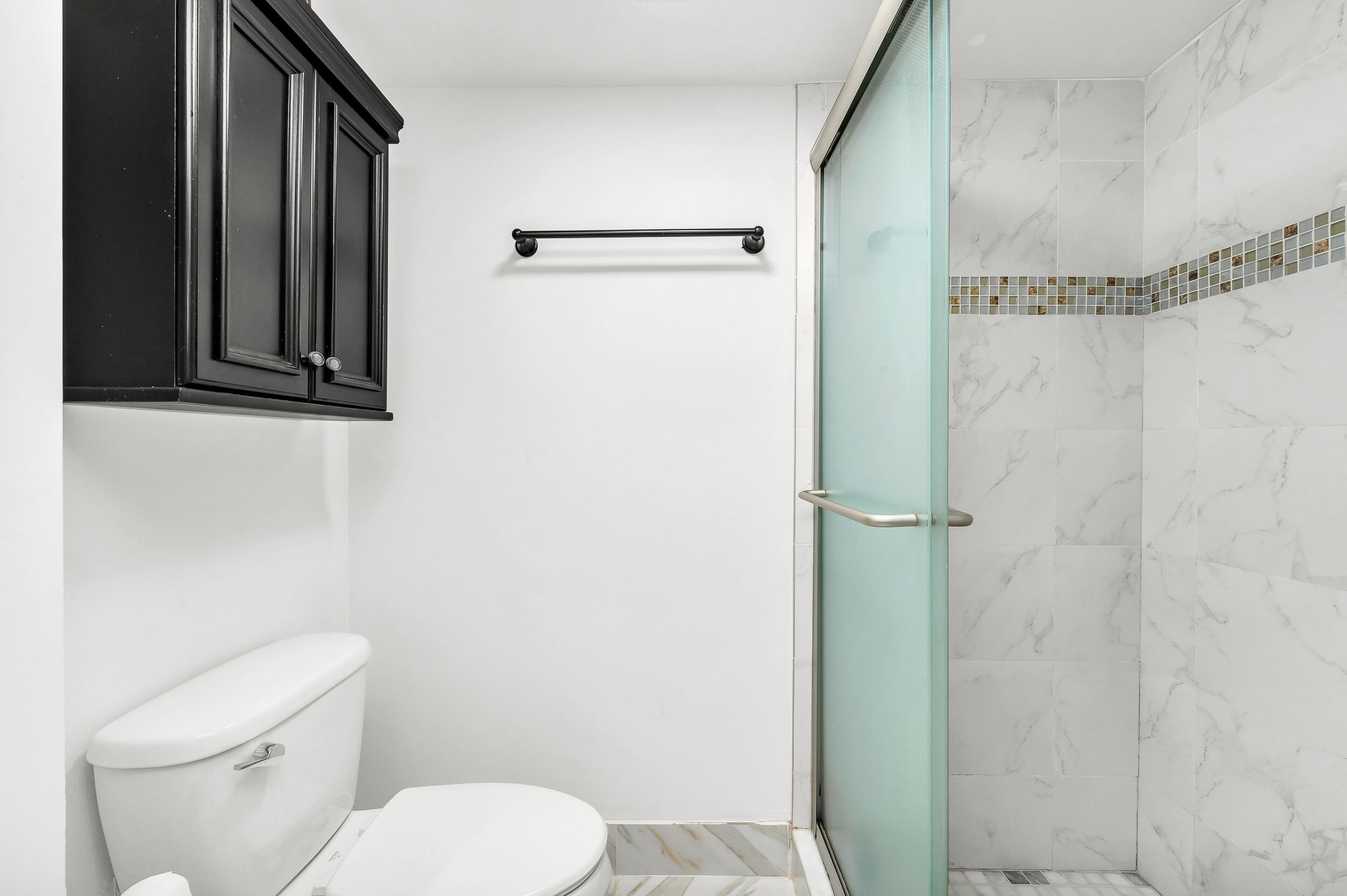 1111 South Ocean Boulevard, Unit 420 Boca Raton, FL 33432 - Photo 14 of 23 a white toilet sitting next to a shower curtain