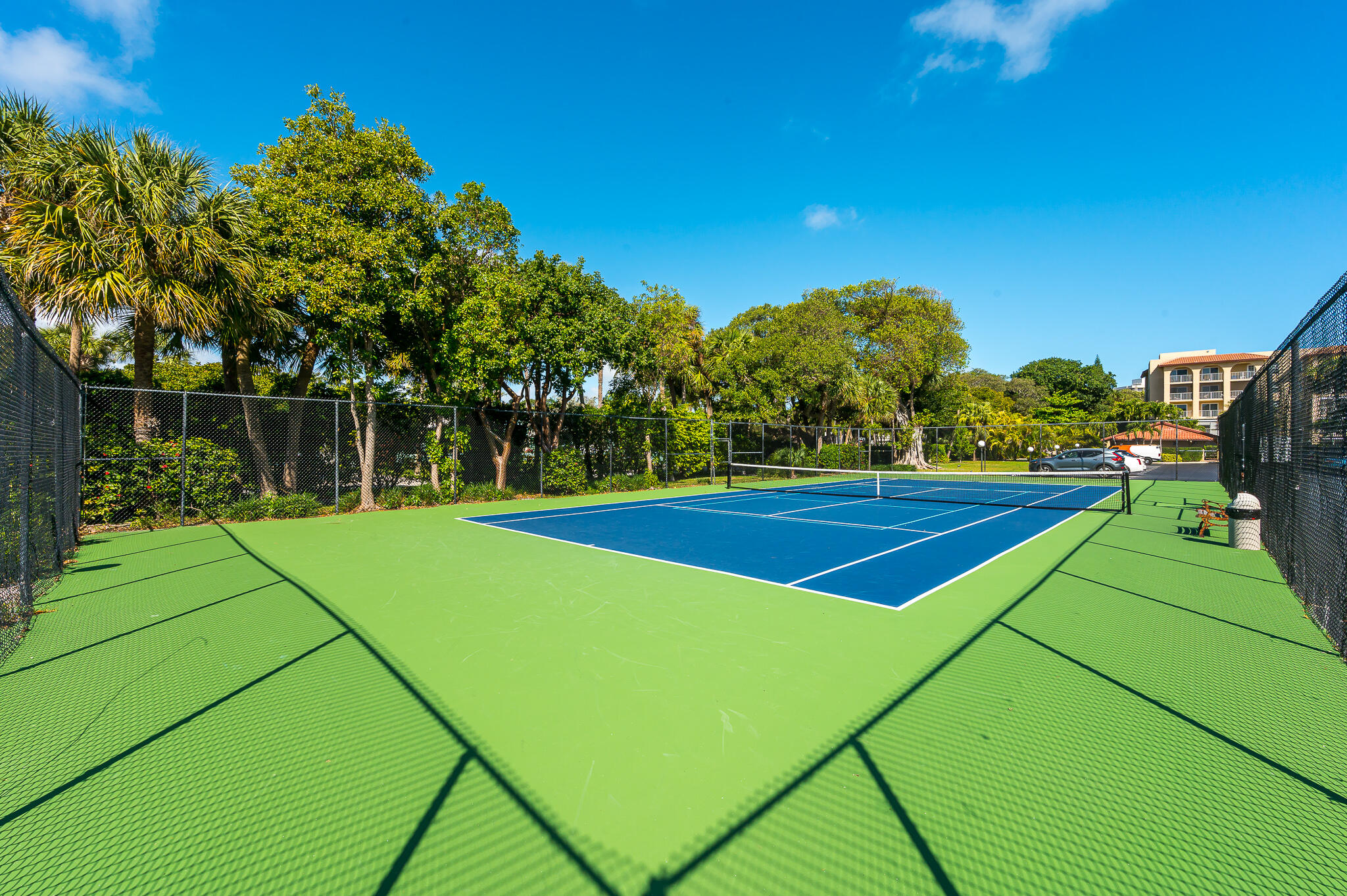 1111 South Ocean Boulevard, Unit 420 Boca Raton, FL 33432 - Photo 18 of 23 a view of an outdoor space and tennis court