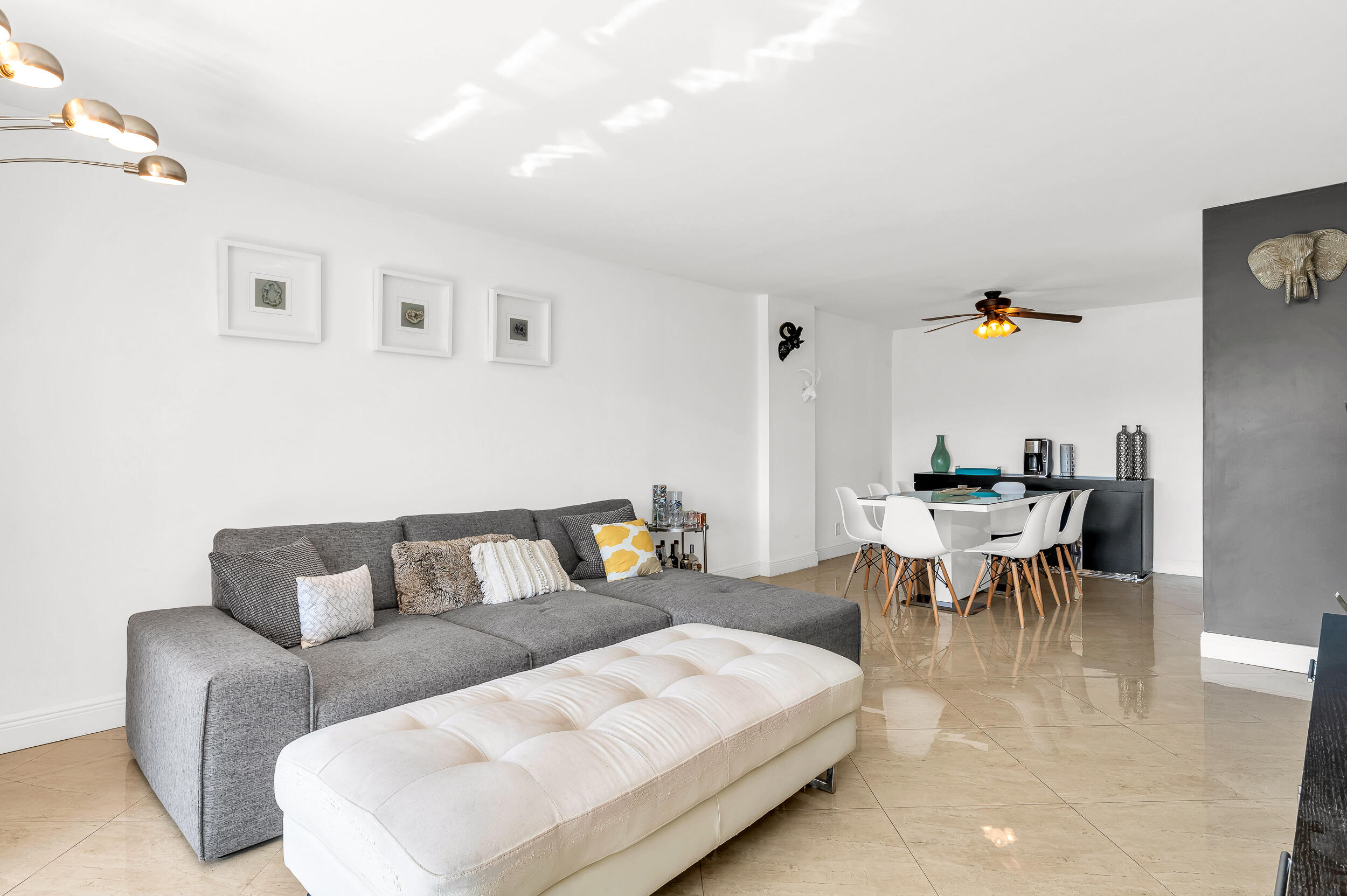 1111 South Ocean Boulevard, Unit 420 Boca Raton, FL 33432 - Photo 6 of 23 a living room with furniture and wooden floor