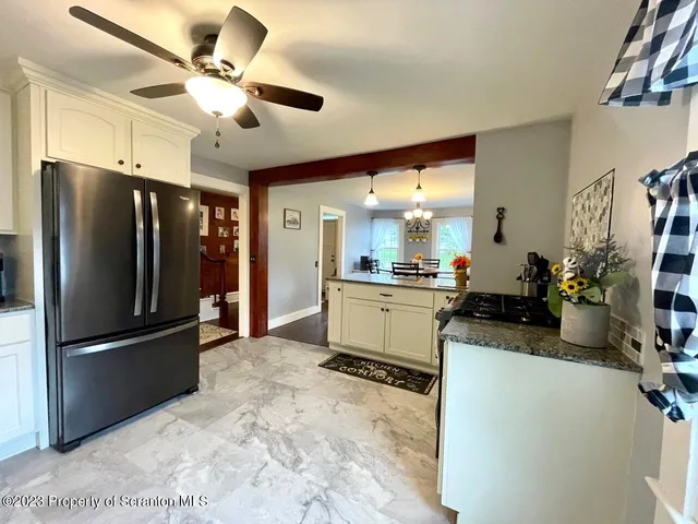 a living room with furniture rug and wooden floor