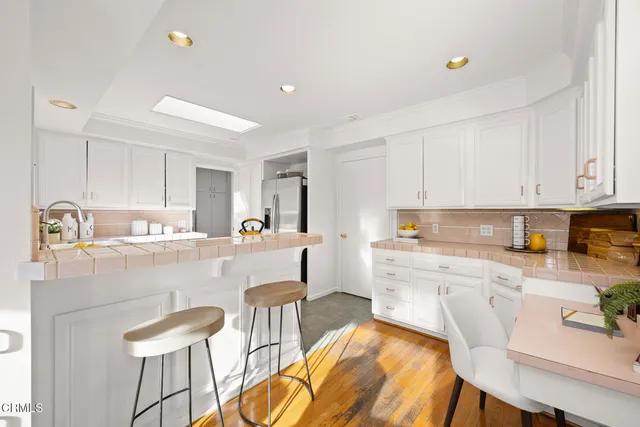 a white bath tub sitting next to a white sink