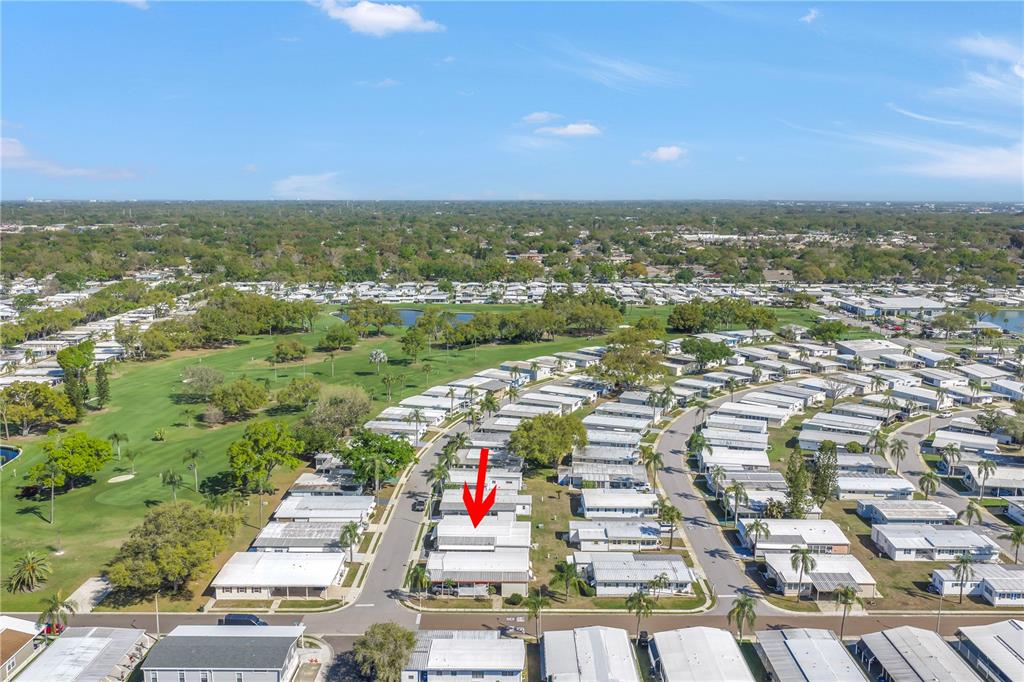 1100 South Belcher Road, Unit 502 Largo, FL 33771 - Photo 49 of 51 an aerial view of residential houses with outdoor space