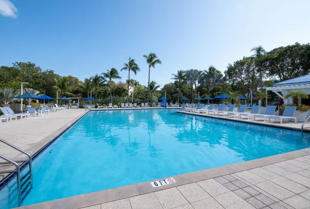 a view of a swimming pool with outdoor seating