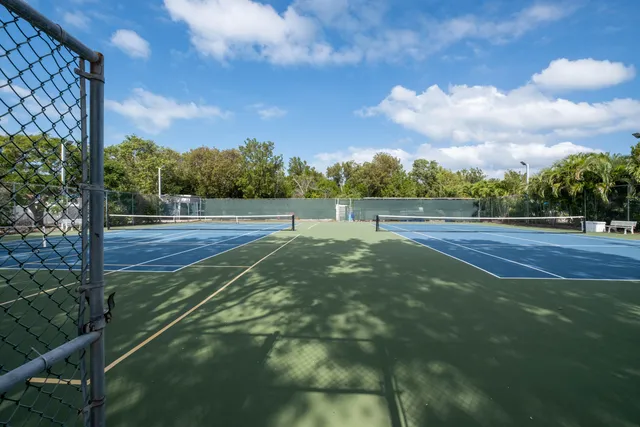a view of an outdoor space and tennis court