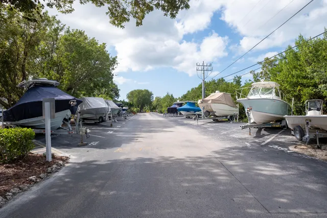 a view of backyard of house with outdoor seating and barbeque oven