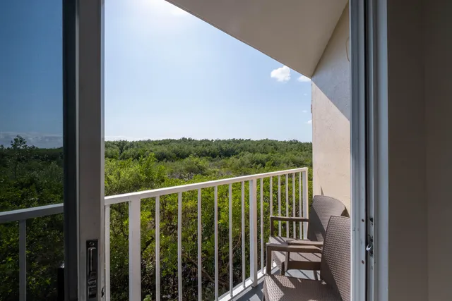 a view of a balcony with wooden floor