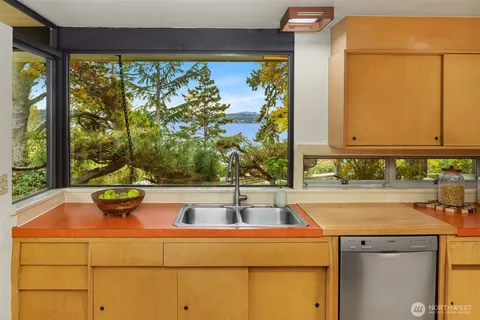 a bed room with a bed and a large window