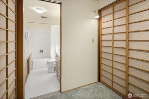 an aerial view of a house with a yard and potted plants