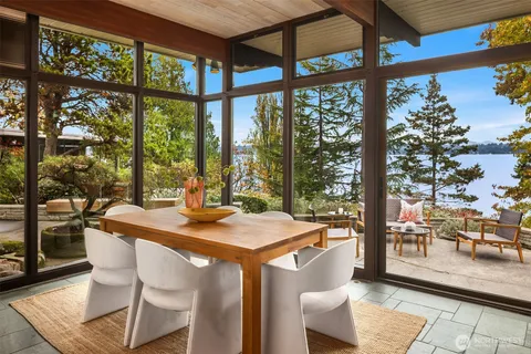 a view of a city from a dining room with large windows