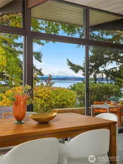 a view of a chairs and table in the patio