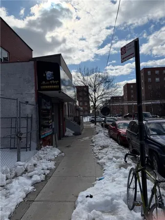 a view of a street with a building in the background