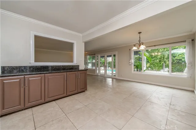 a living room with granite countertop furniture and a kitchen