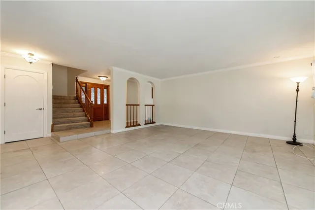 an empty room with a empty space and windows