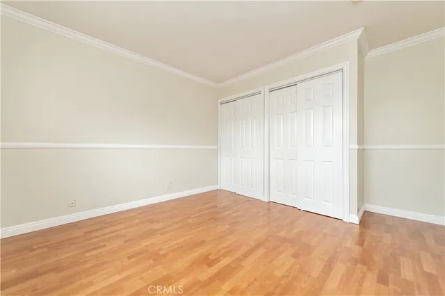 an empty room with wooden floor