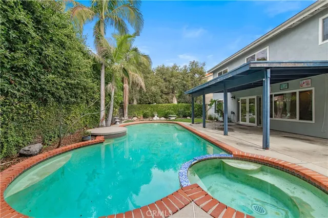 a view of a house with swimming pool