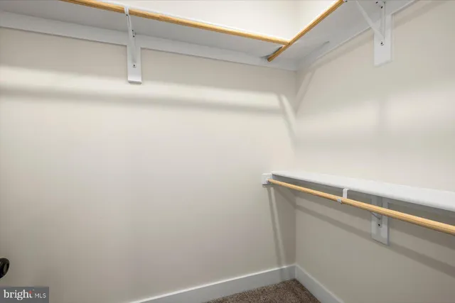 a bathroom with a granite countertop sink a toilet and bathtub