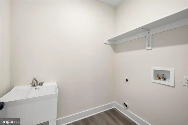 a bathroom with a sink toilet tub and shower